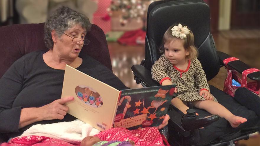 Adult and child reading holiday book