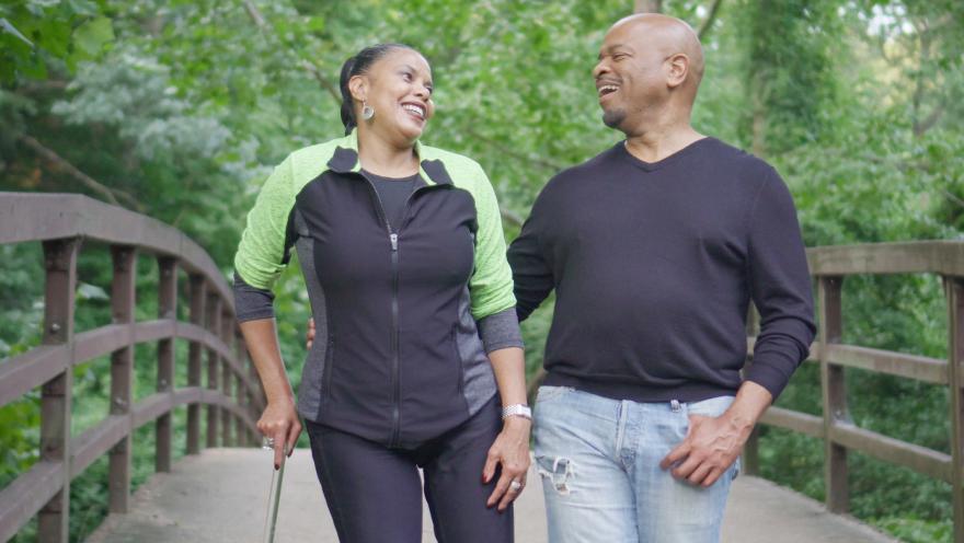 couple walking through park