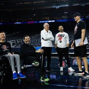 includes Mark, father Steve Fisher, Sergio Ibarra (athletic medicine) and asst coach JD Pollock