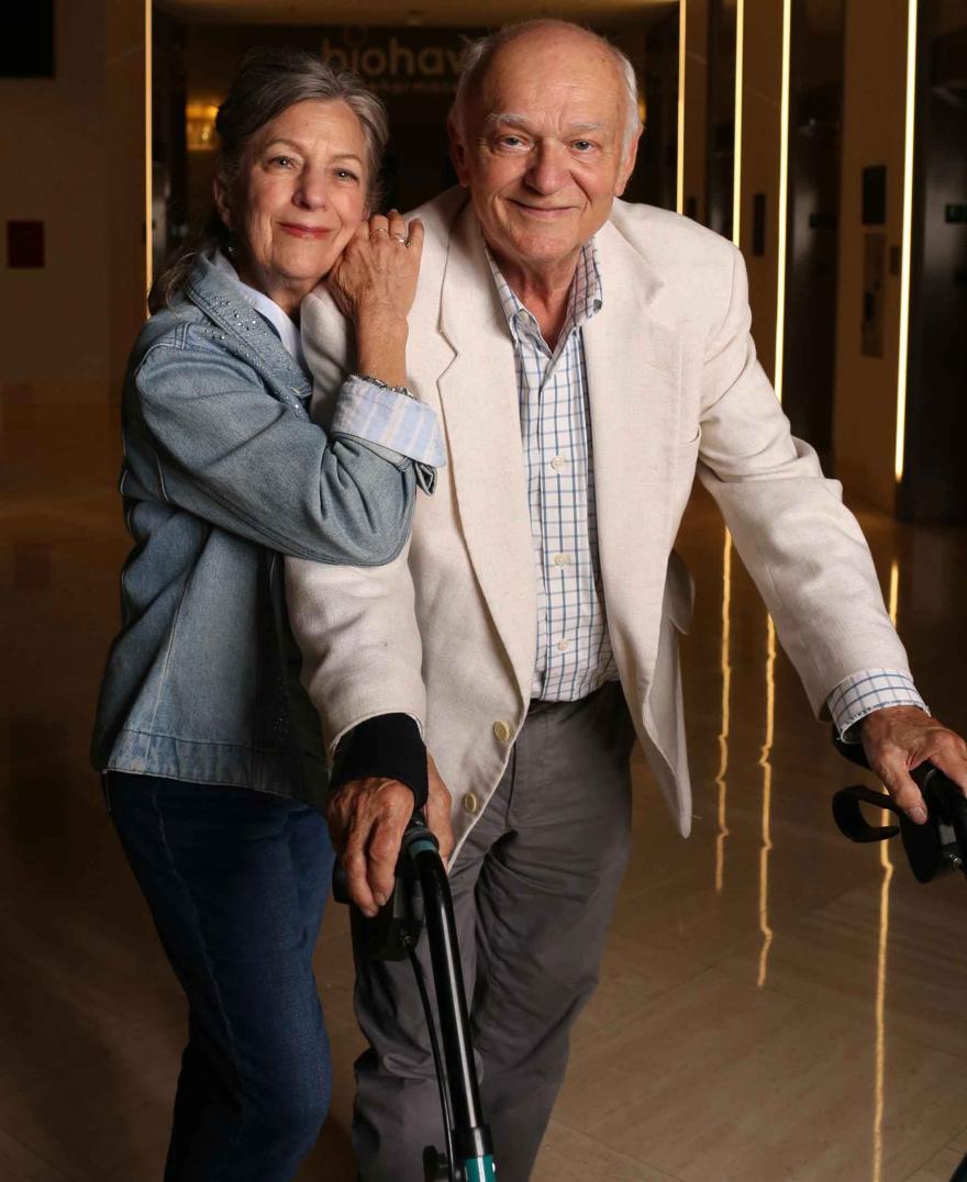 man and woman with walker