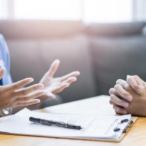 close-up of a doctor and patient talking